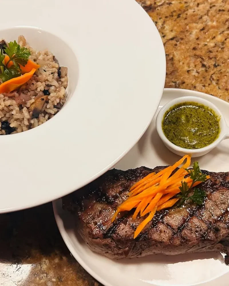 Grilled steak with chimichurri and risotto at Sterling's